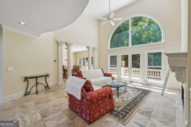 Experience three fully finished levels of exceptional living on The Golf Club of Georgia in Georgia - for sale on GolfHomes.com, golf home, golf lot