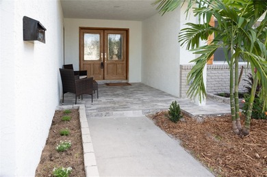 This beautifully remodeled home is in one of St Petersburg's on Pasadena Yacht and Country Club in Florida - for sale on GolfHomes.com, golf home, golf lot