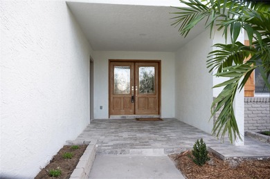 This beautifully remodeled home is in one of St Petersburg's on Pasadena Yacht and Country Club in Florida - for sale on GolfHomes.com, golf home, golf lot