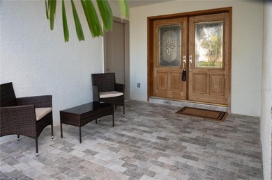 This beautifully remodeled home is in one of St Petersburg's on Pasadena Yacht and Country Club in Florida - for sale on GolfHomes.com, golf home, golf lot