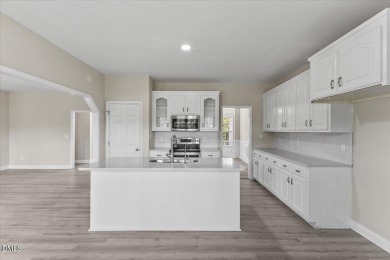 Beautifully updated and designed with timeless Southern charm on The Neuse Golf Club in North Carolina - for sale on GolfHomes.com, golf home, golf lot