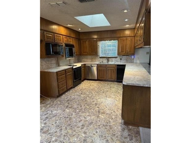Discover this 3 bedroom, 2 bathroom home nestled on a on Hide-A-Way Lake Golf Course in Texas - for sale on GolfHomes.com, golf home, golf lot