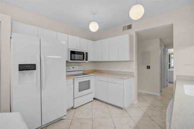Ground Floor End-Unit Condo in Fairway Trace at Peridia Golf & on Peridia Golf and Country Club in Florida - for sale on GolfHomes.com, golf home, golf lot