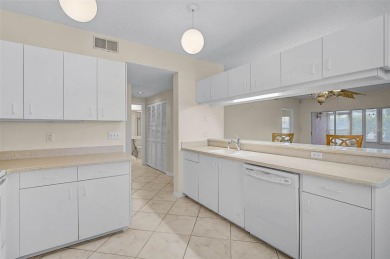 Ground Floor End-Unit Condo in Fairway Trace at Peridia Golf & on Peridia Golf and Country Club in Florida - for sale on GolfHomes.com, golf home, golf lot