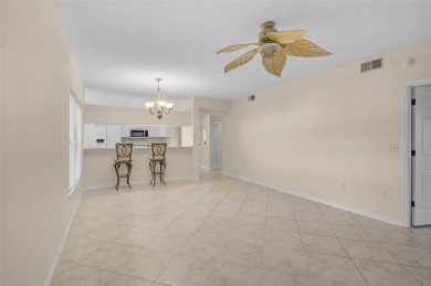 Ground Floor End-Unit Condo in Fairway Trace at Peridia Golf & on Peridia Golf and Country Club in Florida - for sale on GolfHomes.com, golf home, golf lot