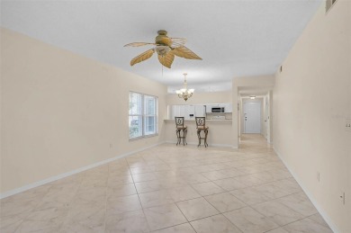 Ground Floor End-Unit Condo in Fairway Trace at Peridia Golf & on Peridia Golf and Country Club in Florida - for sale on GolfHomes.com, golf home, golf lot