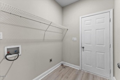 Beautifully updated and designed with timeless Southern charm on The Neuse Golf Club in North Carolina - for sale on GolfHomes.com, golf home, golf lot