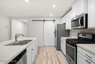 Located in the golf-cart-friendly Grand Reserve Golf Community on Grand Reserve Golf Course in Florida - for sale on GolfHomes.com, golf home, golf lot