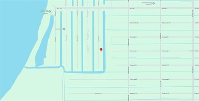 0.50 acre CANAL lot directly on the paved road. Located in the on Indian Lake Estates Golf and Country Club in Florida - for sale on GolfHomes.com, golf home, golf lot