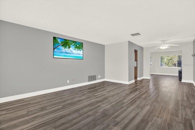 Enjoy maintenance-free, easy Florida living in this 2-bedroom on Mainlands Golf Club in Florida - for sale on GolfHomes.com, golf home, golf lot