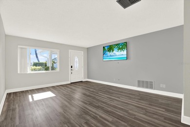 Enjoy maintenance-free, easy Florida living in this 2-bedroom on Mainlands Golf Club in Florida - for sale on GolfHomes.com, golf home, golf lot