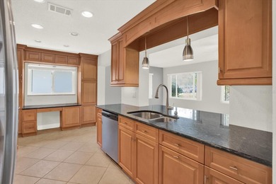 Enjoy maintenance-free, easy Florida living in this 2-bedroom on Mainlands Golf Club in Florida - for sale on GolfHomes.com, golf home, golf lot