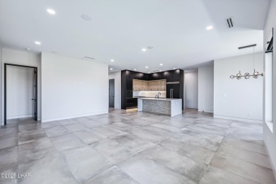 Located at 2446 E La Mancha in the prestigious gated community on Los Lagos Golf Club in Arizona - for sale on GolfHomes.com, golf home, golf lot