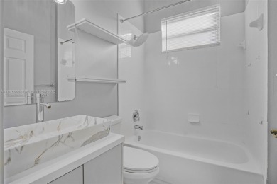 Stunning 4-bedroom, 3-bath home in the serene, gated Augusta on Keys Gate Golf Club in Florida - for sale on GolfHomes.com, golf home, golf lot