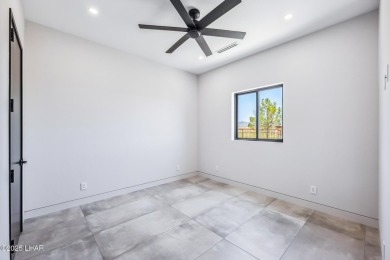 Located at 2446 E La Mancha in the prestigious gated community on Los Lagos Golf Club in Arizona - for sale on GolfHomes.com, golf home, golf lot