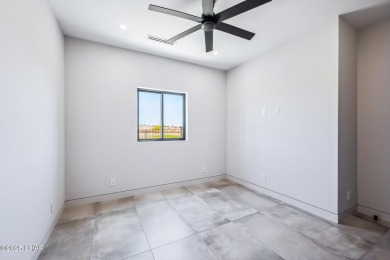 Located at 2446 E La Mancha in the prestigious gated community on Los Lagos Golf Club in Arizona - for sale on GolfHomes.com, golf home, golf lot