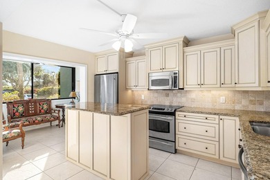 Serene golf course and pond views enhance this first-floor on Quail Ridge Golf Course and Country Club in Florida - for sale on GolfHomes.com, golf home, golf lot