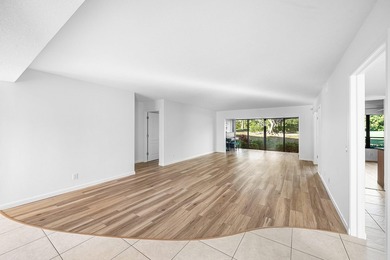 Serene golf course and pond views enhance this first-floor on Quail Ridge Golf Course and Country Club in Florida - for sale on GolfHomes.com, golf home, golf lot