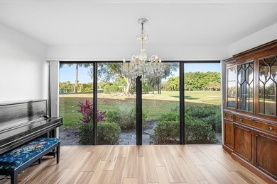 Serene golf course and pond views enhance this first-floor on Quail Ridge Golf Course and Country Club in Florida - for sale on GolfHomes.com, golf home, golf lot