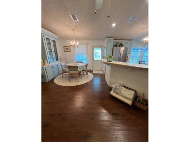 Delightful and meticulously maintained home, partially furnished on Lake Henry Golf Club in Florida - for sale on GolfHomes.com, golf home, golf lot