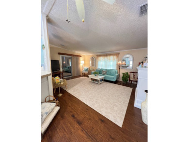 Delightful and meticulously maintained home, partially furnished on Lake Henry Golf Club in Florida - for sale on GolfHomes.com, golf home, golf lot