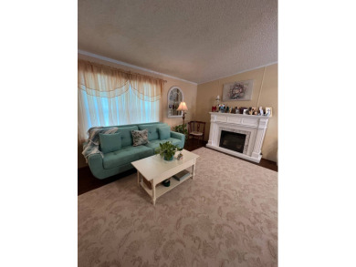 Delightful and meticulously maintained home, partially furnished on Lake Henry Golf Club in Florida - for sale on GolfHomes.com, golf home, golf lot