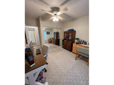 Delightful and meticulously maintained home, partially furnished on Lake Henry Golf Club in Florida - for sale on GolfHomes.com, golf home, golf lot