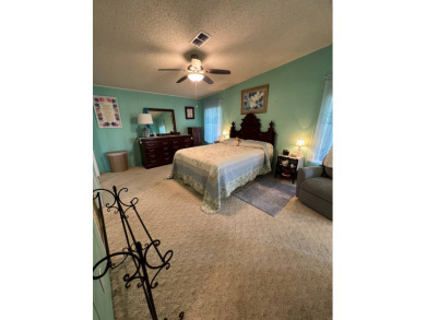 Delightful and meticulously maintained home, partially furnished on Lake Henry Golf Club in Florida - for sale on GolfHomes.com, golf home, golf lot