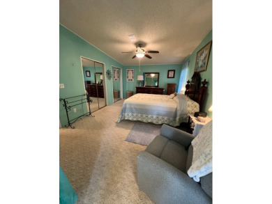 Delightful and meticulously maintained home, partially furnished on Lake Henry Golf Club in Florida - for sale on GolfHomes.com, golf home, golf lot
