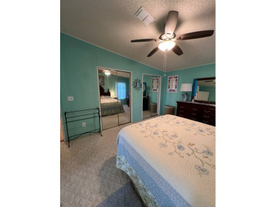 Delightful and meticulously maintained home, partially furnished on Lake Henry Golf Club in Florida - for sale on GolfHomes.com, golf home, golf lot