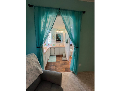 Delightful and meticulously maintained home, partially furnished on Lake Henry Golf Club in Florida - for sale on GolfHomes.com, golf home, golf lot
