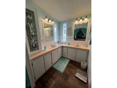 Delightful and meticulously maintained home, partially furnished on Lake Henry Golf Club in Florida - for sale on GolfHomes.com, golf home, golf lot