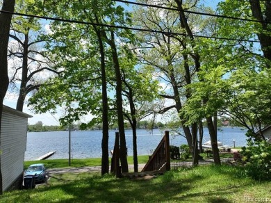 You truly can have it all!   Lakefront Luxury Meets Serene on Faulkwood Shores Golf Course in Michigan - for sale on GolfHomes.com, golf home, golf lot