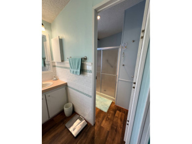 Delightful and meticulously maintained home, partially furnished on Lake Henry Golf Club in Florida - for sale on GolfHomes.com, golf home, golf lot