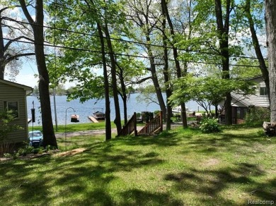 You truly can have it all!   Lakefront Luxury Meets Serene on Faulkwood Shores Golf Course in Michigan - for sale on GolfHomes.com, golf home, golf lot