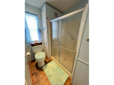 Delightful and meticulously maintained home, partially furnished on Lake Henry Golf Club in Florida - for sale on GolfHomes.com, golf home, golf lot