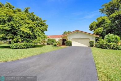 *** DISCOVER UNPARALLELED ELEGANCE NESTLED ON OVER HALF AN ACRE on Country Club of Coral Springs in Florida - for sale on GolfHomes.com, golf home, golf lot