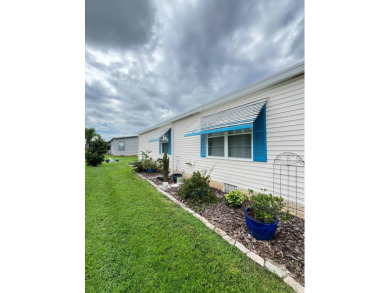 Delightful and meticulously maintained home, partially furnished on Lake Henry Golf Club in Florida - for sale on GolfHomes.com, golf home, golf lot