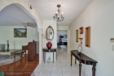 *** DISCOVER UNPARALLELED ELEGANCE NESTLED ON OVER HALF AN ACRE on Country Club of Coral Springs in Florida - for sale on GolfHomes.com, golf home, golf lot