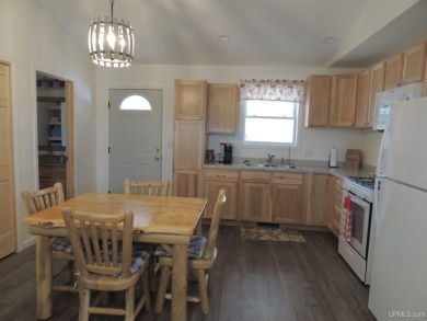 Just pack your bags and move right in to this immaculate totally on Nahma Club in Michigan - for sale on GolfHomes.com, golf home, golf lot