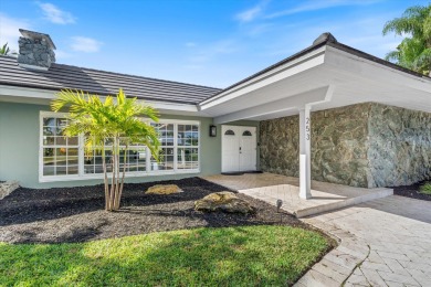 This charming 5-bedroom home offers a perfect blend of comfort on Atlantis Golf Club in Florida - for sale on GolfHomes.com, golf home, golf lot