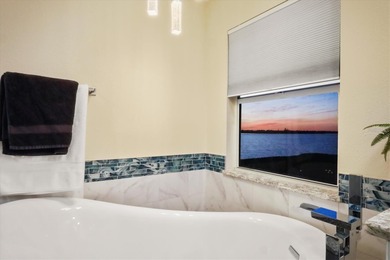 Spectacular Southwest Florida sunsets take center stage at this on Lemon Bay Golf Club in Florida - for sale on GolfHomes.com, golf home, golf lot