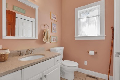 Stunning custom Cape Cod style home in a sought-after lake and on Harbor Hills Country Club in Ohio - for sale on GolfHomes.com, golf home, golf lot