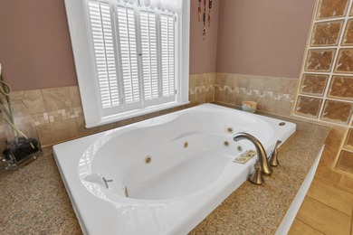 Stunning custom Cape Cod style home in a sought-after lake and on Harbor Hills Country Club in Ohio - for sale on GolfHomes.com, golf home, golf lot