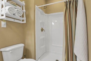 Stunning custom Cape Cod style home in a sought-after lake and on Harbor Hills Country Club in Ohio - for sale on GolfHomes.com, golf home, golf lot