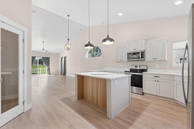 Experience easy living in this beautifully designed single-level on Village Greens Golf Club in Montana - for sale on GolfHomes.com, golf home, golf lot