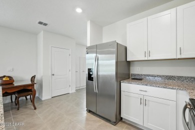 Discover the exceptional value of this pristine 2023 DR Horton on Halifax Plantation Golf Club in Florida - for sale on GolfHomes.com, golf home, golf lot