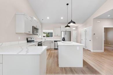 Experience easy living in this beautifully designed single-level on Village Greens Golf Club in Montana - for sale on GolfHomes.com, golf home, golf lot