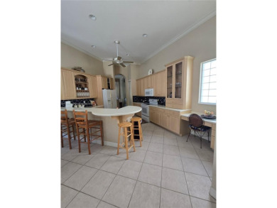 Enter through a private entrance to a peacefully courtyard with on Kensington Golf and Country Club in Florida - for sale on GolfHomes.com, golf home, golf lot