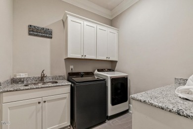 Experience luxury living in this stunning executive home located on MacGregor Downs Country Club in North Carolina - for sale on GolfHomes.com, golf home, golf lot